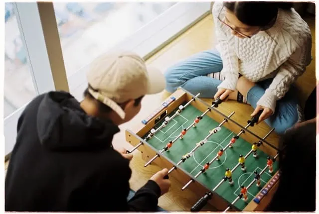 couple playing foosball