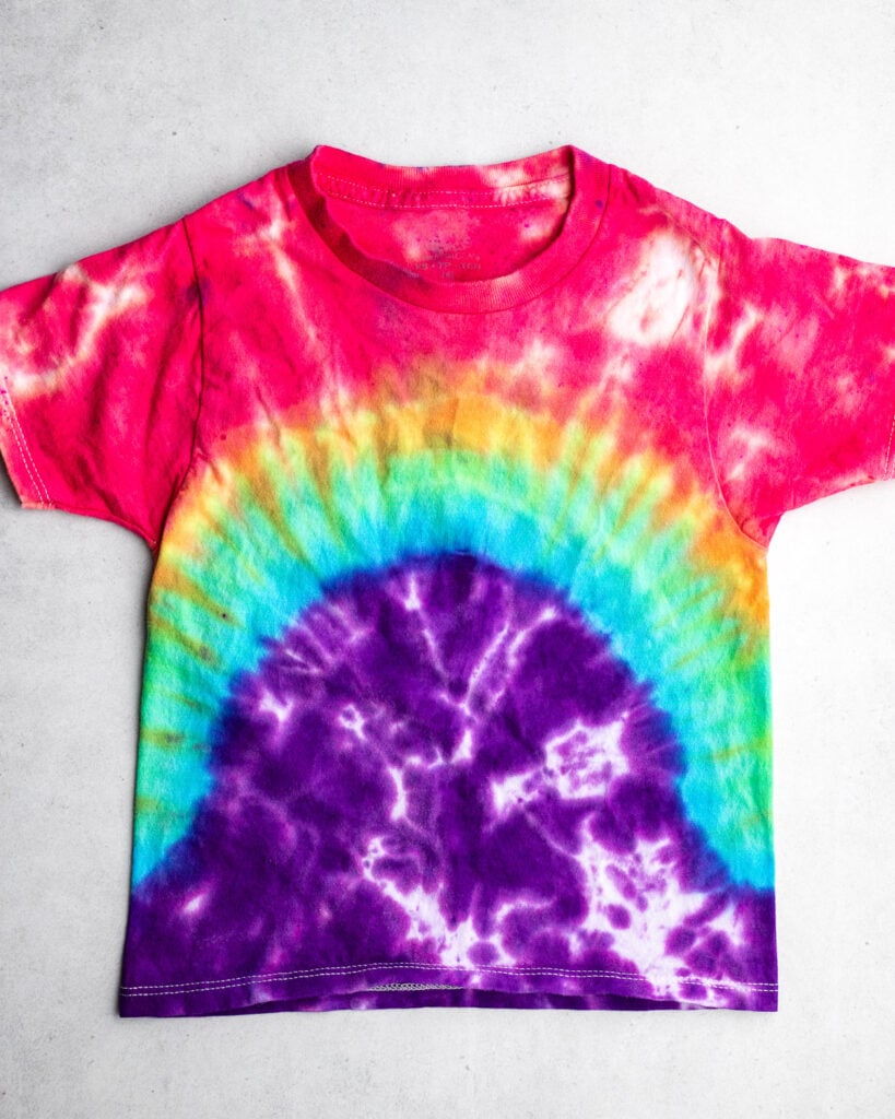 tie dye tshirt in rainbow colors with a rainbow arch design